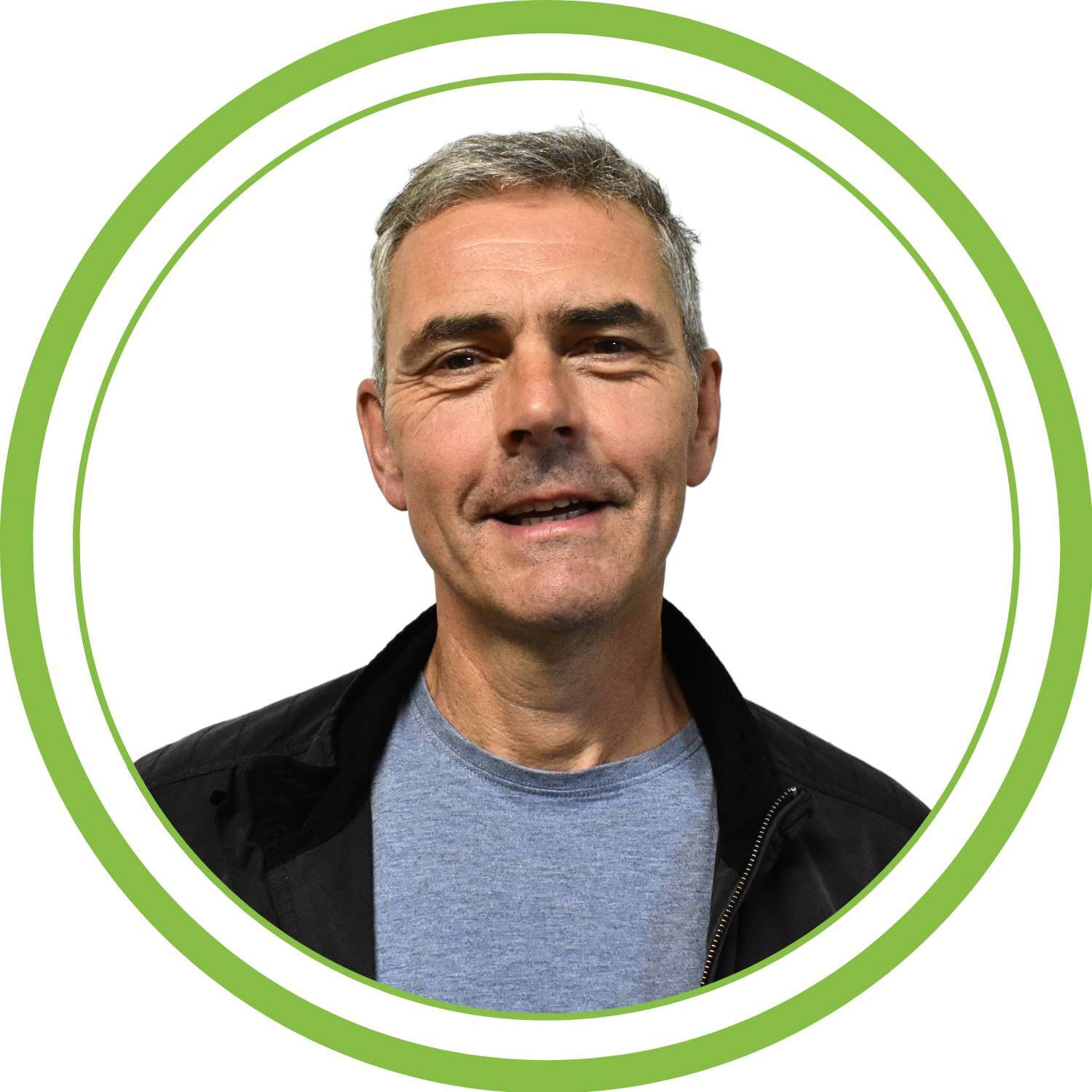 A picture of Steve M, one of our trainers with a green circular frame and white background.
