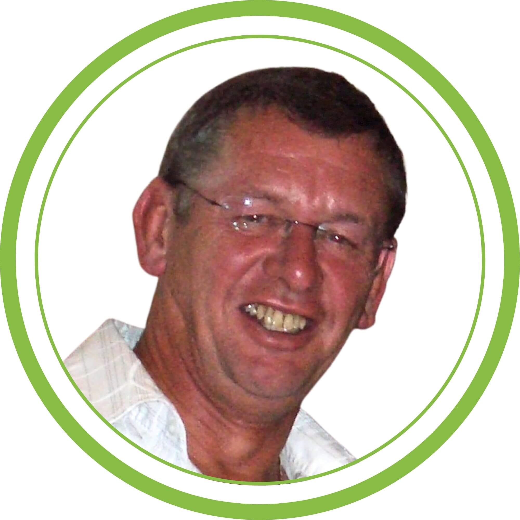 A photo of Mike, one of our trainers, with a white background and a green circular frame.