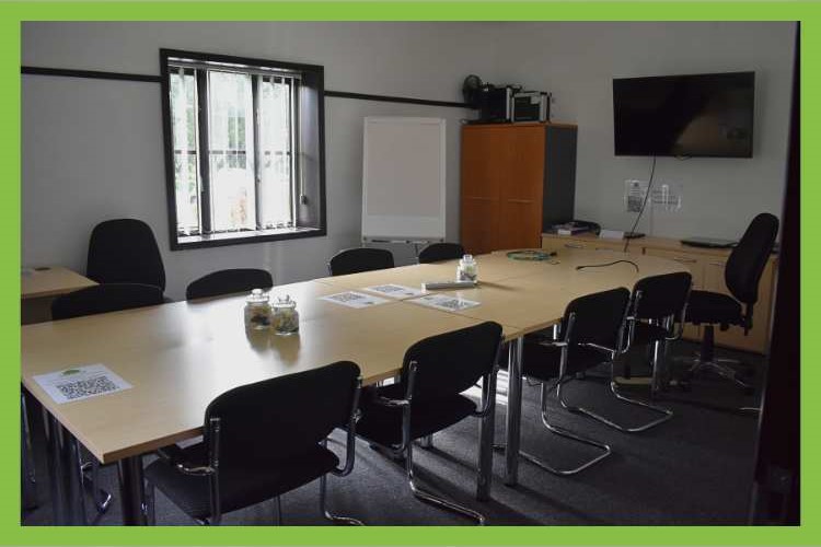 training room, table with chairs, windows, monitor
